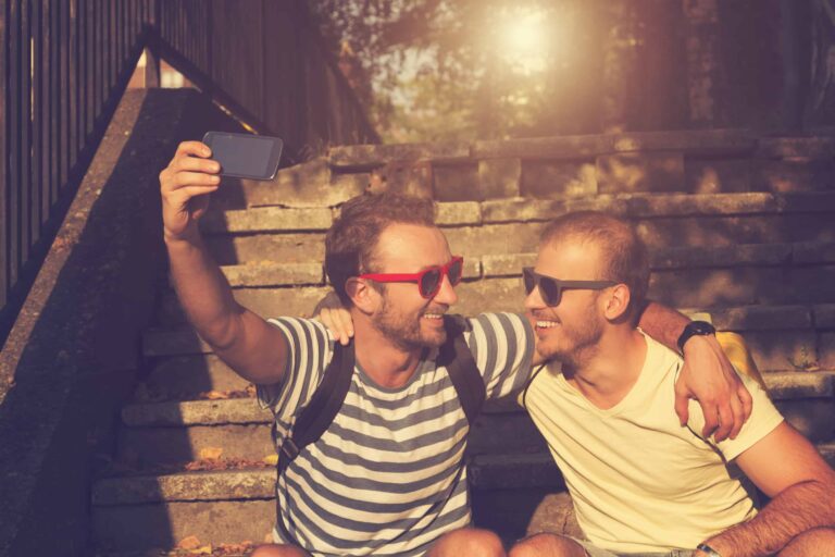 Two men taking a selfie together.