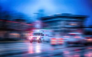 Ambulance carrying carfentanil overdose victim in the rain