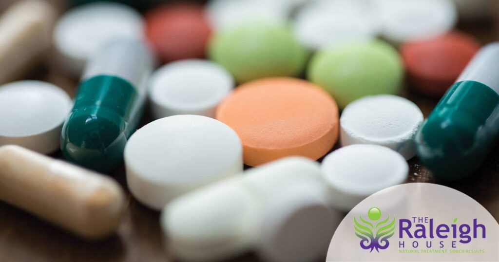 An assortment of brightly colored pills on a table.
