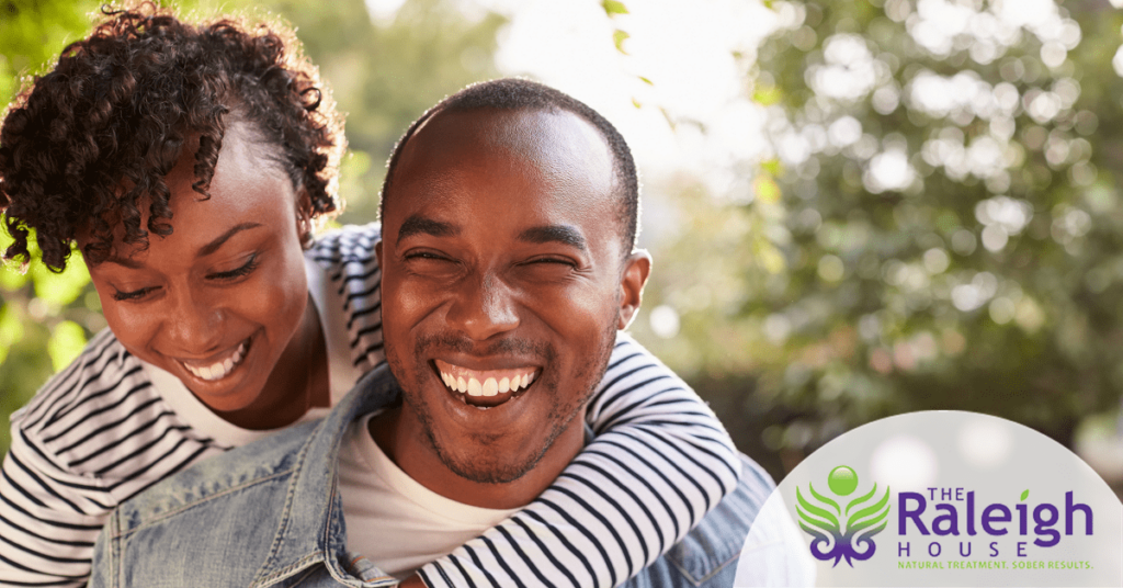 A laughing couple enjoys a day in the great outdoors.