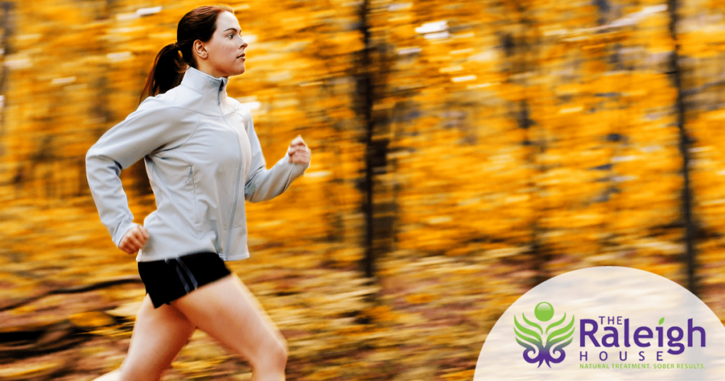 A woman going for a run in the woods