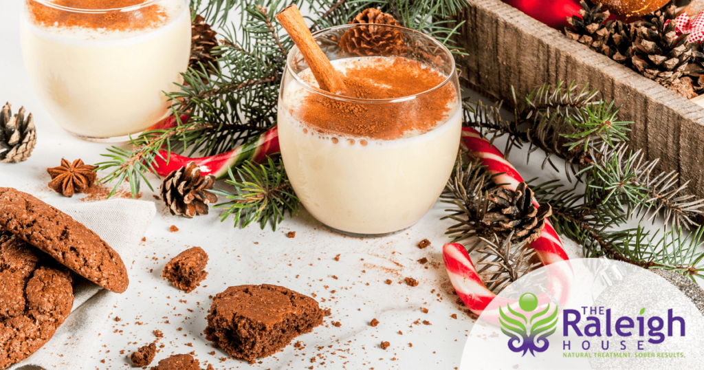 A table is set with non-alcoholic eggnog and chocolate cookies.