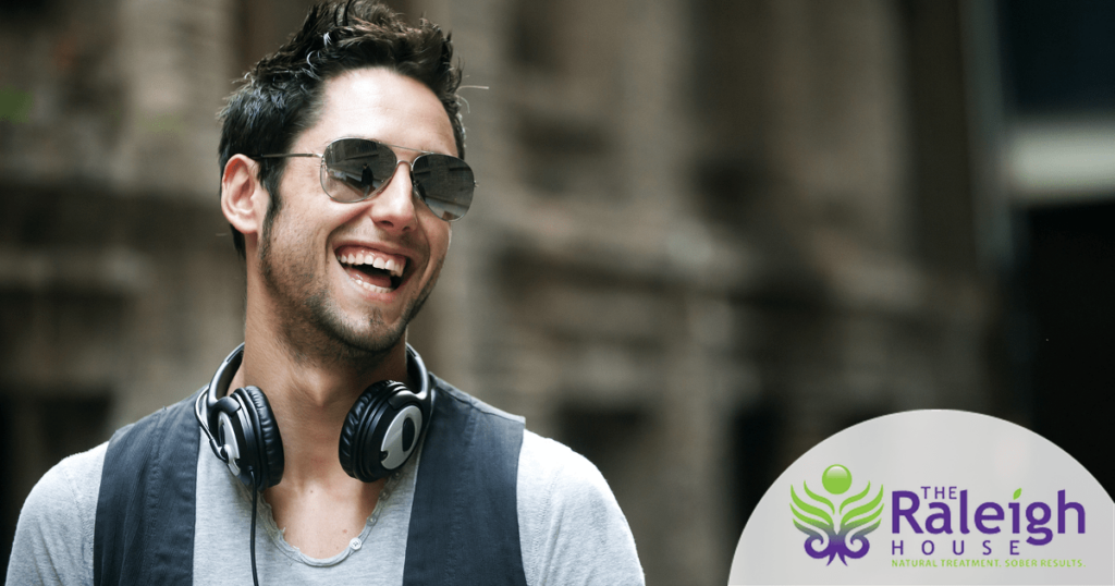 A young man flaunts his beautiful smile and white teeth.