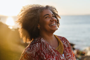 Happy woman outside at the beach