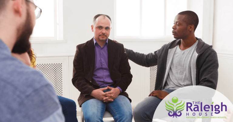 Adults attend a group therapy session.