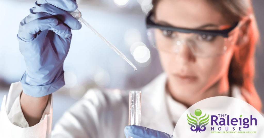 A female researcher does work with a test tube.