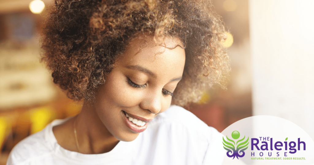 A young woman flashes a beautiful smile.