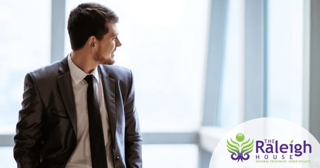 Man in a suit looking off to the side