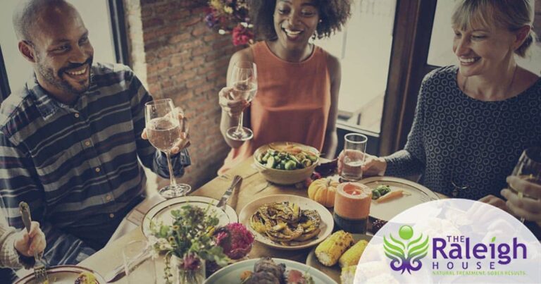 Friends dining around a table