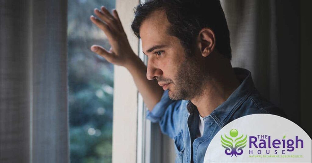 Man staring out a window