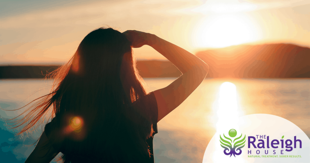 Woman staring at a sunset