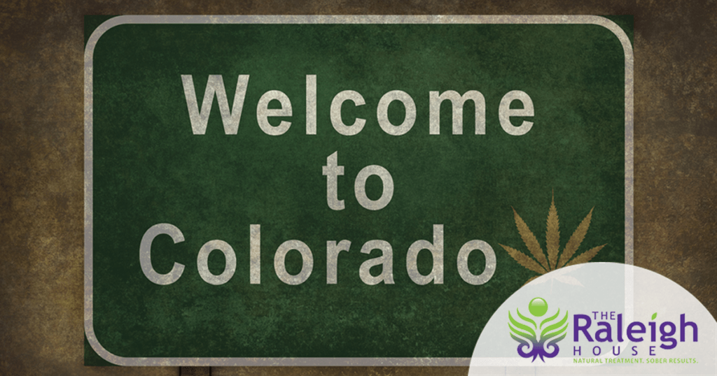 A marijuana leaf is superimposed on an image of a Colorado road sign