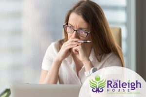 Woman struggling to concentrate on her work because of her anxiety disorder.