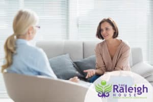 A woman opening up to her therapist in an individual therapy session during residential treatment.
