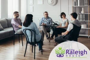A group of people in addiction treatment participating in a psychoeducation therapy session.