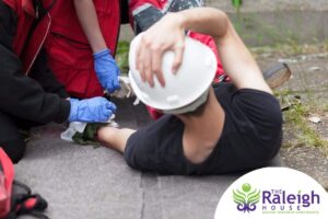 A construction worker being treated for a workplace injury.