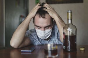 A man turning to alcohol to cope with his loneliness and isolation.