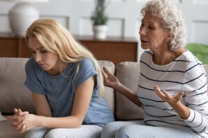 A mother trying to talk to her adult daughter about her destructive behaviors.