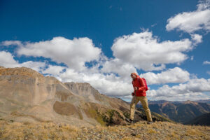 A man hiking through the mountains in Colorado.