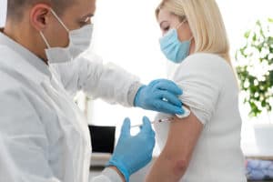 A woman struggling with substance abuse getting the COVID-19 Vaccine