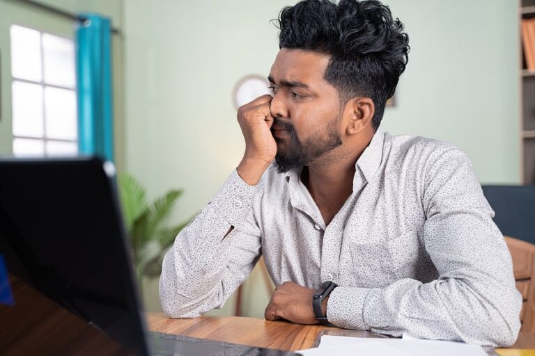 Young man at his computer