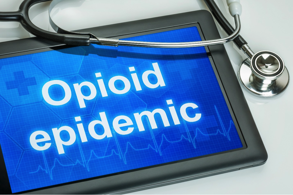 opioid epidemic written on digital tablet and stethoscope