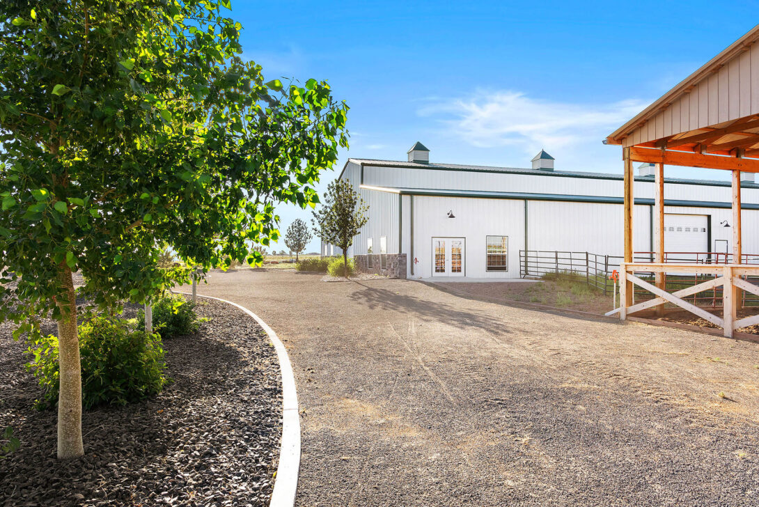 Outside view of the Raleigh House path to white building