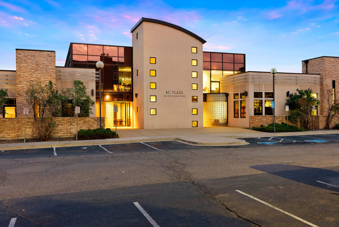 Twilight view of the front of The Raleigh House building