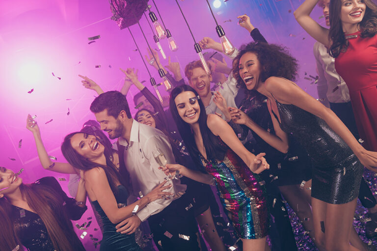 Group of young people dancing at a party