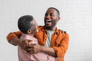 Happy an hugging his father
