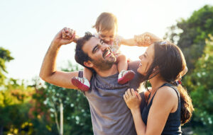 Happy dad with his baby on his shoulders