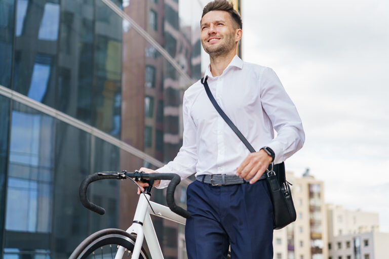 Man with his bike in the city