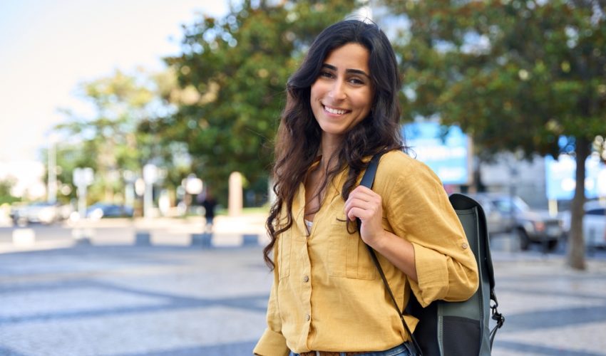 Smiling,Portrait,Of,Beautiful,Middle,Eastern,Israel,Girl,Student,With Woman outside with a backpack in urban area